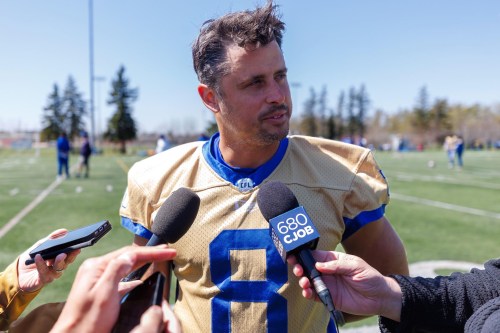 MIKE DEAL / FREE PRESS
Winnipeg Blue Bombers’ quarterback, Zach Collaros (8) talks to reporters after the first day of rookie camp at the field beside Winnipeg Soccer Federation South on Wednesday.
250507 - Wednesday, May 07, 2025.