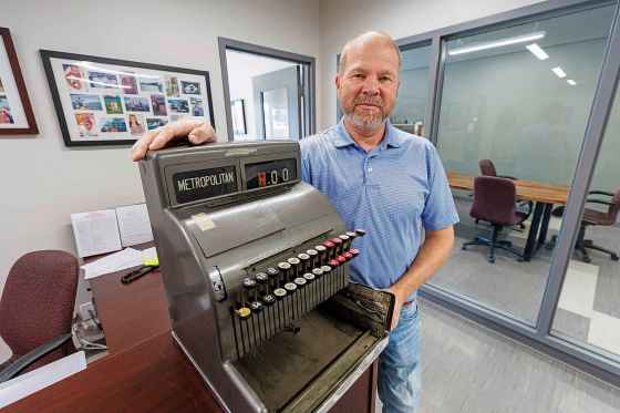 Christian Klopick was shocked to have the vintage cash register, which was a fixture at Tenderloin Meat and Sausage, returned. (Mike Deal / Free Press)