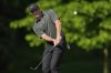 Rory McIlroy, of Northern Ireland, chips to the green on the 12th hole during the first round of the PGA Championship golf tournament at the Quail Hollow Club, Thursday, May 15, 2025, in Charlotte, N.C. (AP Photo/David J. Phillip)