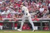 Milwaukee Brewers' Christian Yelich watches his solo home run during the third inning of a baseball game against the Cincinnati Reds, Monday, June 2, 2025, in Cincinnati. (AP Photo/Jeff Dean)