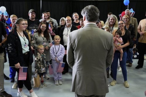 Deputy Secretary of State Christopher Landau greets Afrikaner refugees from South Africa, Monday, May 12, 2025, at Dulles International Airport in Dulles, Va. (AP Photo/Julia Demaree Nikhinson)