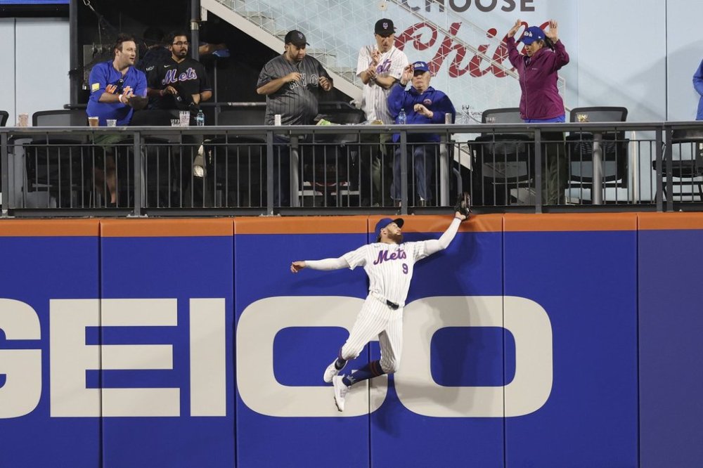 New York Mets outfielder Brandon Nimmo (9) catches a ball hit by Pittsburgh Pirates' Joey Bart during the eighth inning of a baseball game Monday, May 12, 2025, in New York. (AP Photo/Pamela Smith)