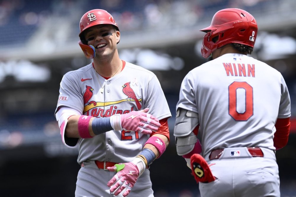 St. Louis Cardinals' Lars Nootbaar, left, celebrates his home run with Masyn Winn (0) during the first inning of a baseball game against the Washington Nationals, Sunday, May 11, 2025, in Washington. (AP Photo/Nick Wass)