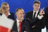 Presidential candidate Karol Nawrocki, a conservative historian backed by the right-wing Law and Justice party greets supporters as he arrives at his headquarters after the presidential election runoff in Warsaw, Poland, Sunday, June 1, 2025. (AP Photo/Czarek Sokolowski)