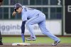 Toronto Blue Jays infielder Andres Gimenez (0) rounds second base after sliding during a baseball game against the Houston Astros on Wednesday, April 23, 2025, in Houston. (AP Photo/Michael Wyke)
