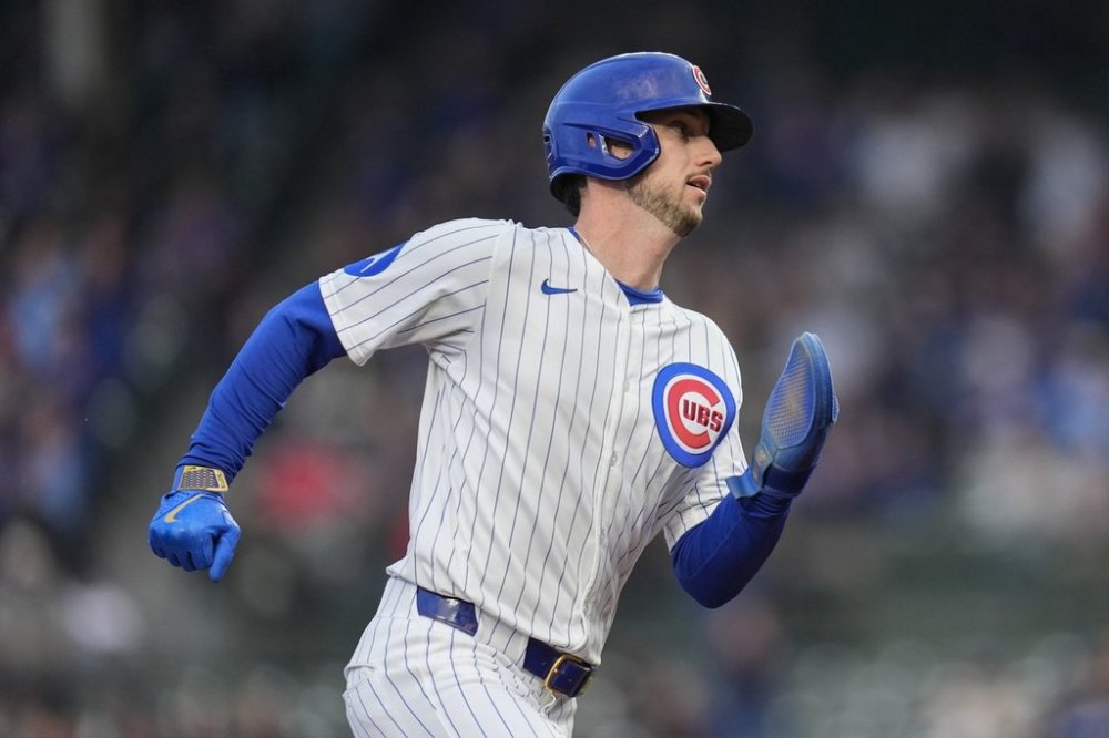 Chicago Cubs' Kyle Tucker (30) runs the bases to score on a double from designated hitter Seiya Suzuki (27) during the first inning of a baseball game against the Colorado Rockies, Wednesday, May 28, 2025, in Chicago. (AP Photo/Erin Hooley)