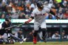 Cleveland Guardians' Carlos Santana hits a two-run double against the Detroit Tigers to drive in José Ramírez and Kyle Manzardo during the fourth inning of a baseball game Thursday, May 22, 2025, in Detroit. (AP Photo/Duane Burleson)