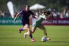 Calgary Wild's Kahli Johnson, left, and Vancouver Rise's Lisa Pechersky vie for the ball during the second half of an NSL soccer match, in Burnaby, B.C., on Saturday, May 24, 2025. THE CANADIAN PRESS/Darryl Dyck