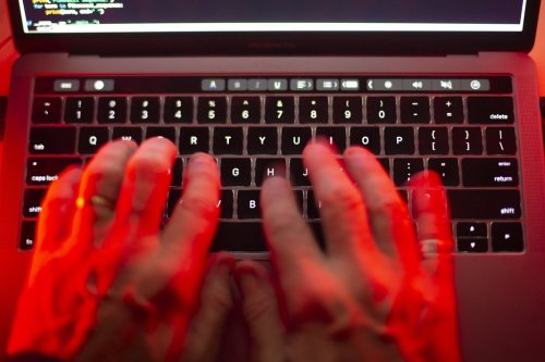 A man uses a computer keyboard in Toronto in this Oct. 9, 2023 photo illustration. THE CANADIAN PRESS/Graeme Roy