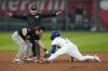 Kansas City Royals' Bobby Witt Jr. beats the tag by Chicago White Sox shortstop Chase Meidroth (10) to steal second during the fourth inning of a baseball game, Monday, May 5, 2025, in Kansas City, Mo. (AP Photo/Charlie Riedel)
