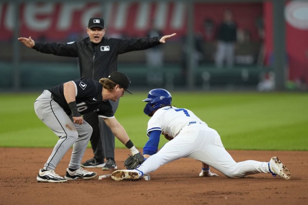 Kansas City Royals' Bobby Witt Jr. beats the tag by Chicago White Sox shortstop Chase Meidroth (10) to steal second during the fourth inning of a baseball game, Monday, May 5, 2025, in Kansas City, Mo. (AP Photo/Charlie Riedel)