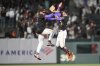 San Francisco Giants shortstop Willy Adames, left, and second baseman Christian Koss celebrate after a baseball game against the Arizona Diamondbacks in San Francisco, Tuesday, May 13, 2025. (AP Photo/Jeff Chiu)