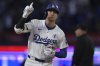 Los Angeles Dodgers' Shohei Ohtani rounds the bases on a solo home run in the seventh inning of a baseball game against the New York Mets, Monday, June 2, 2025, in Los Angeles. (AP Photo/Jayne Kamin-Oncea)