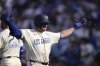 Los Angeles Dodgers' Max Muncy has seeds thrown at him after hitting a three-run home run during the second inning of a baseball game against the New York Yankees, Saturday, May 31, 2025, in Los Angeles. (AP Photo/Mark J. Terrill)