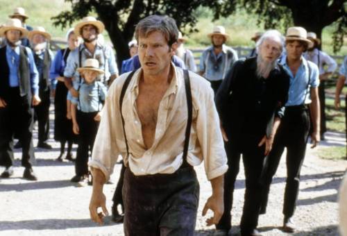 (from IMDB)
                                In the 1985 thriller Witness, Harrison Ford portrays a cop protecting an Amish boy and his mom after the boy witnesses a murder in a Philadelphia train station.
