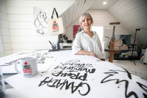 MIKAELA MACKENZIE / FREE PRESS 	 Artist Kal Barteski with the new Free Press merchandise in her studio on Thursday, April 24, 2025. For Conrad Sweatman story. Winnipeg Free Press 2025