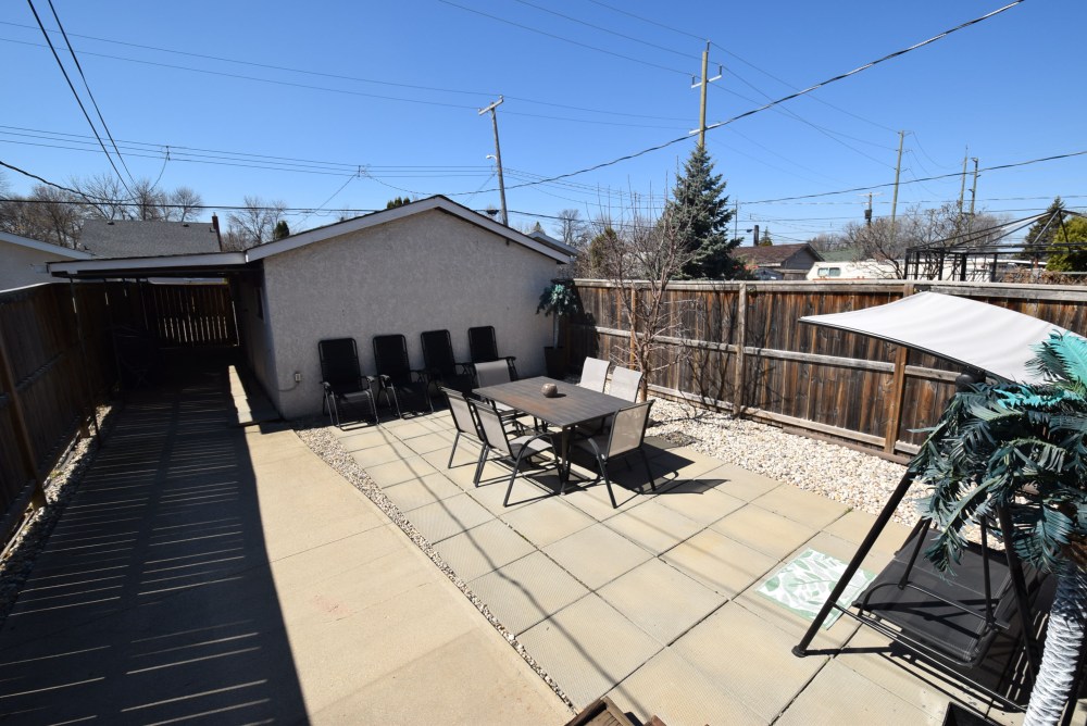 Todd Lewys / Free Press
The maintenance-free backyard is deeper than most in the neighbourhood and features a spacious patio area and walkway to an oversized double garage.