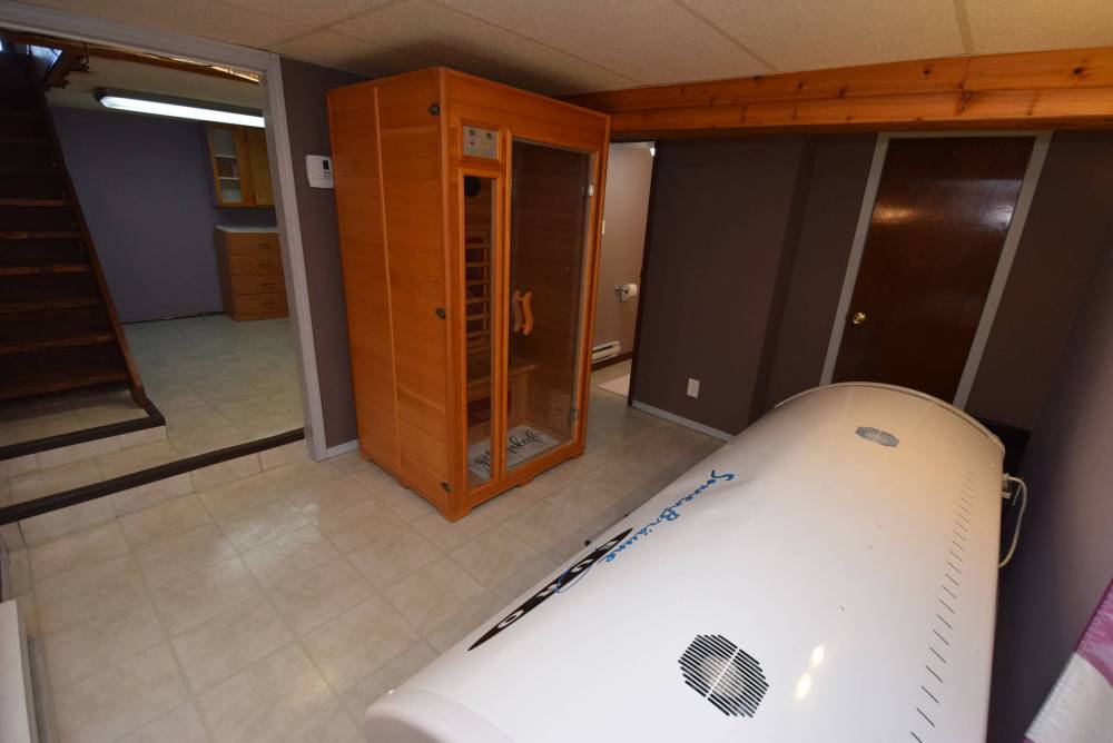 Todd Lewys / Free Press
The home’s lower level features a flex space with portable sauna and tanning bed, as well as a bedroom, bathroom and laundry room.