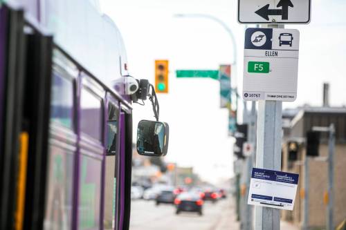 MIKAELA MACKENZIE / FREE PRESS
                                A new bus stop sign on Notre Dame Avenue near Ellen Street. Winnipeg Transit will launch a new primary transit network on June 29.