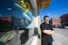 MIKAELA MACKENZIE / FREE PRESS
                                Johnny Thi, owner of Saigon Grind, is happy with the recent downtown cleaup on Thursday.