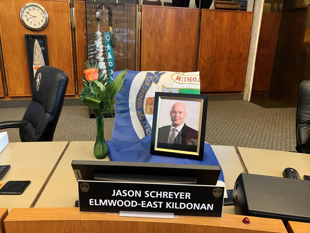 JOYANNE PURSAGA / FREE PRESS
                                Items were placed at the council chamber desk of late Elmwood-East Kildonan councillor Jason Schreyer before a meeting Friday.