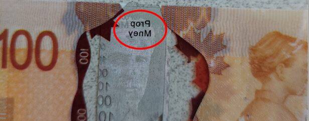 SUPPLIED‘Prop money’ printed in reverse on a $100 bill