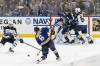 St. Louis Blues left wing Pavel Buchnevich (89) battles Winnipeg Jets defenseman Dylan Samberg (54) in front of Jets goaltender Connor Hellebuyck Friday. (Jeff Le / The Asscoiated Press)