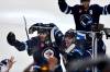 Winnipeg Jets’ Adam Lowry (17) celebrates his game-winning goal against the St. Louis Blues with Haydn Fleury (24) in the second overtime period of NHL round one, game seven Stanley Cup playoff action in Winnipeg, Sunday, May 4, 2025. (Fred Greenslade / The Canadian Press)