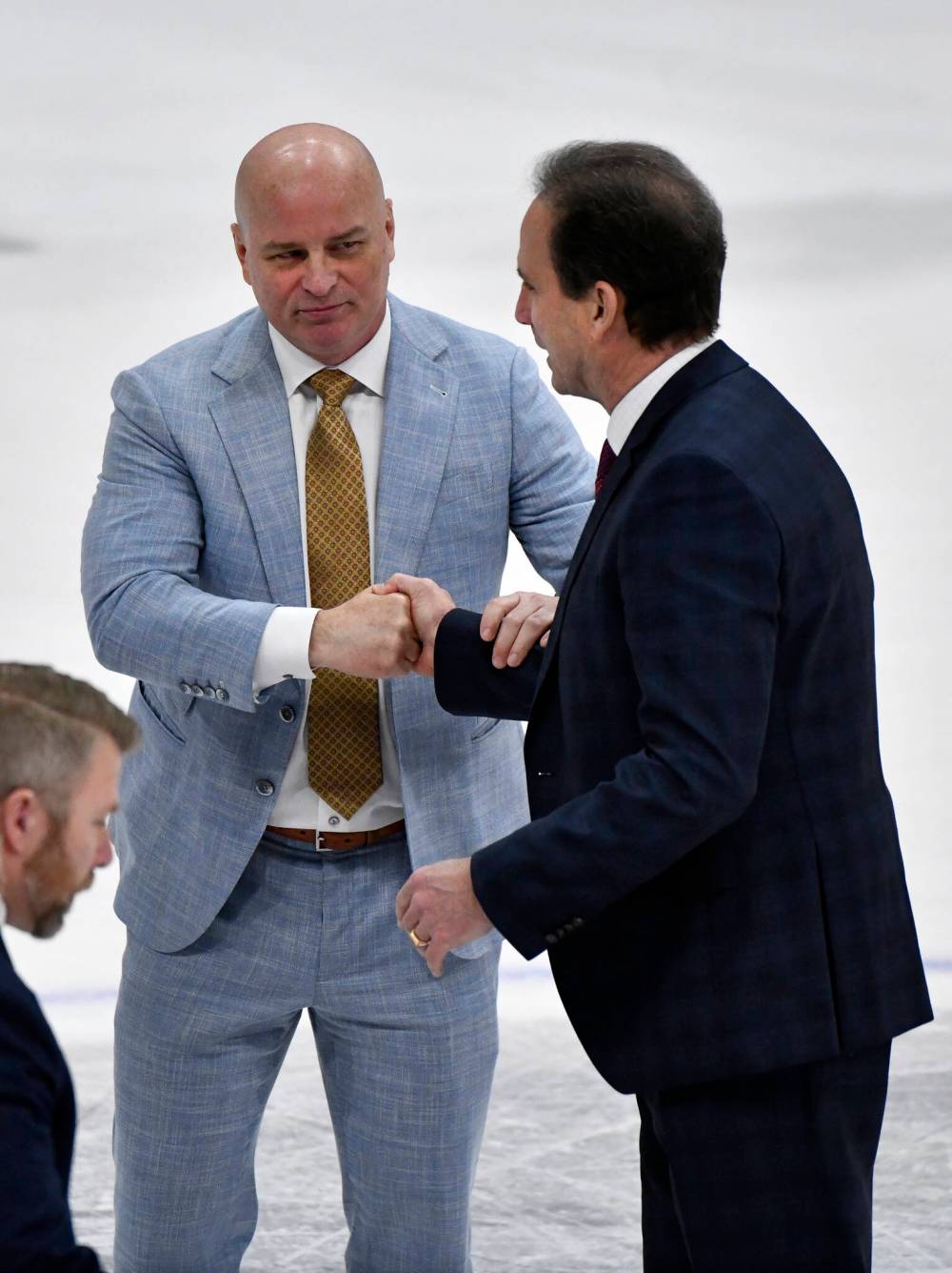 St. Louis Blues’ head coach Jim Montgomery (Left) shakes hands with shakes hands with Winnipeg Jets’ head coach Scott Arniel at the end of the game. (Fred Greenslade / The Canadian Press)