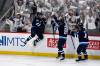 Winnipeg Jets’ Cole Perfetti (91) celebrates his goal to tie the game against the St. Louis Blues with Kyle Connor (81) and Neal Pionk (4) during third period NHL round one, game seven Stanley Cup playoff action in Winnipeg, Sunday May 4, 2025. (Fred Greenslade / The Canadian Press)