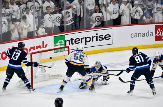 Winnipeg Jets’ Cole Perfetti scores the latest game-tying goal in NHL Game 7 history on St. Louis Blues goaltender Jordan Binnington to push overtime on May 4. (Fred Greenslade / The Canadian Press)