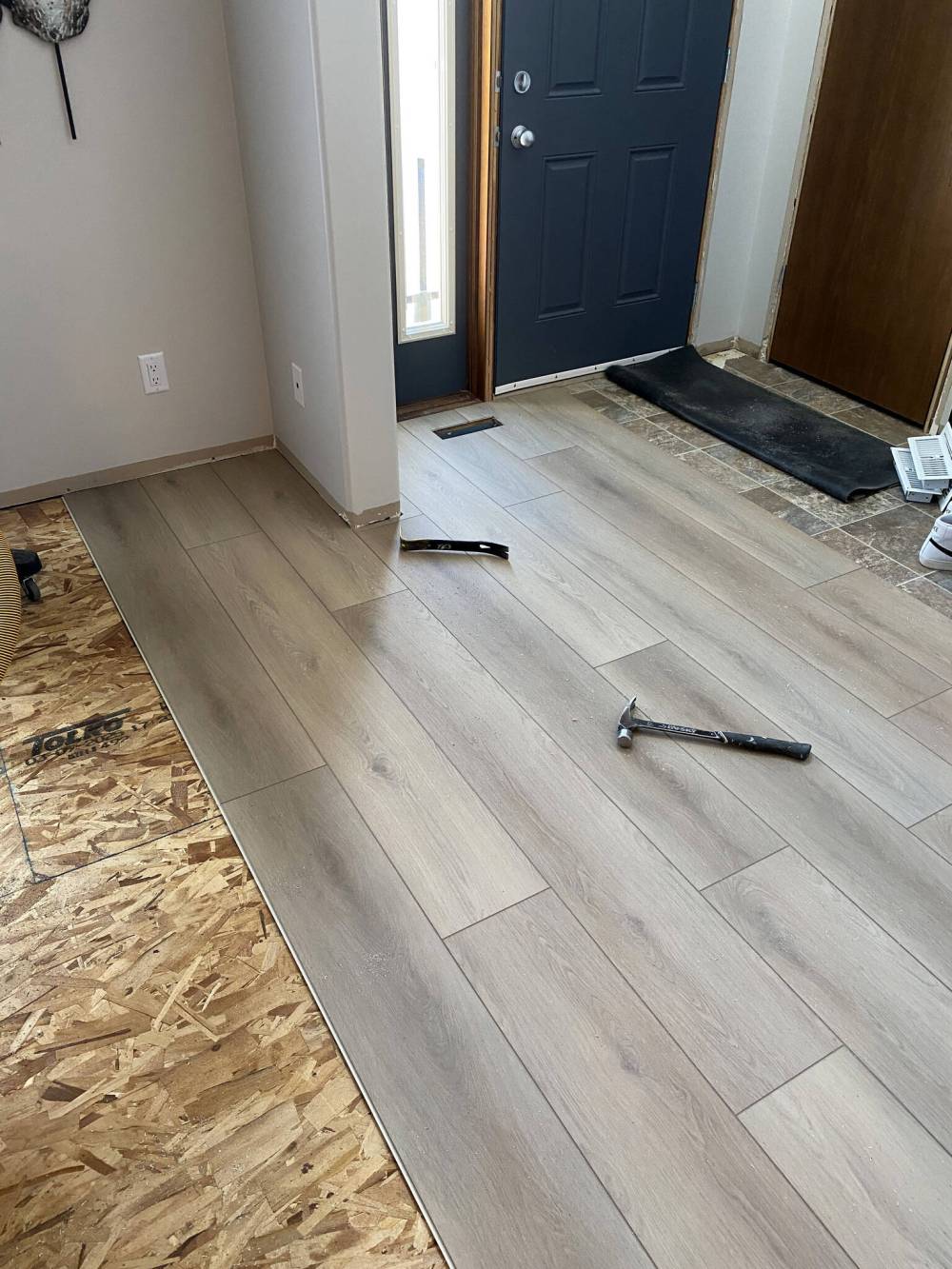 MARC LABOSSIERE / FREE PRESS
Once the sub-floor elevation is made consistent, vinyl-plank installation can begin.