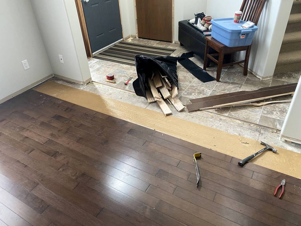 MARC LABOSSIERE / FREE PRESS
The carpet and hardwood flooring removal revealed a sub-floor elevation discrepancy prior to vinyl-plank installation.