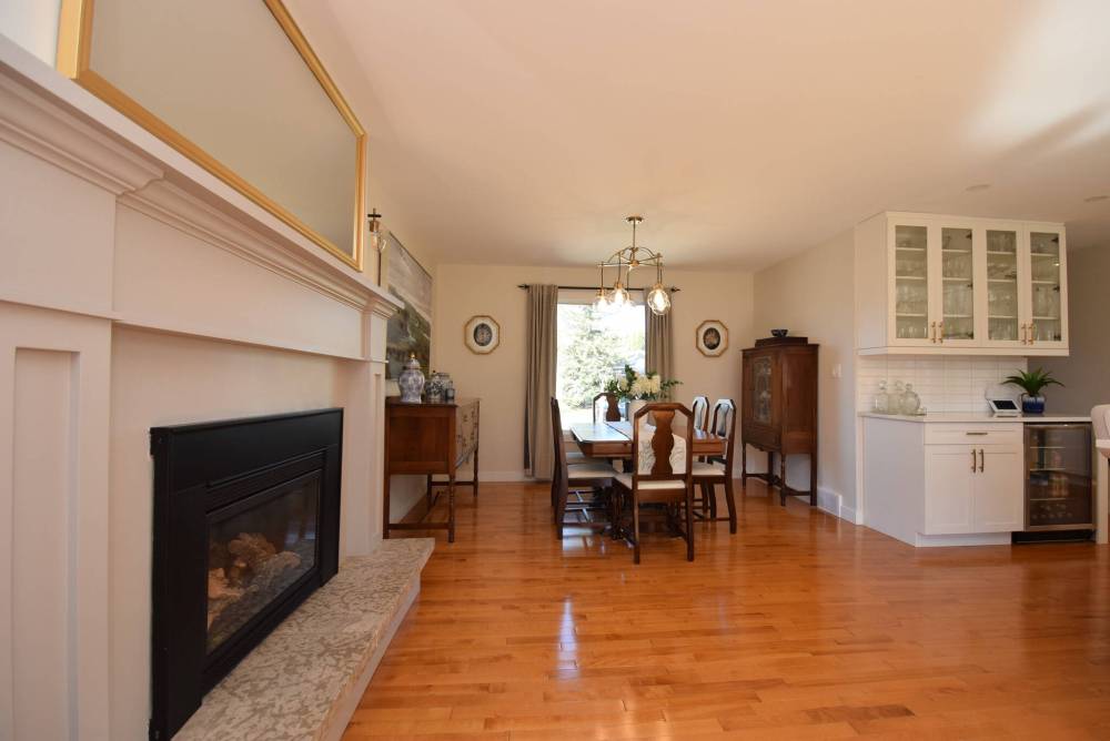 TODD LEWYS / FREE PRESS
A wall next to the kitchen was removed to open it up to a roomy formal dining area with wet bar and lovely gas fireplace.