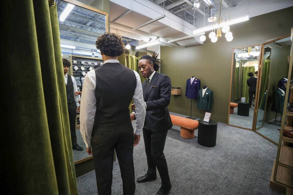 Ruth Bonneville / Free Press
Eph tailor Caelan Norea fits a client.