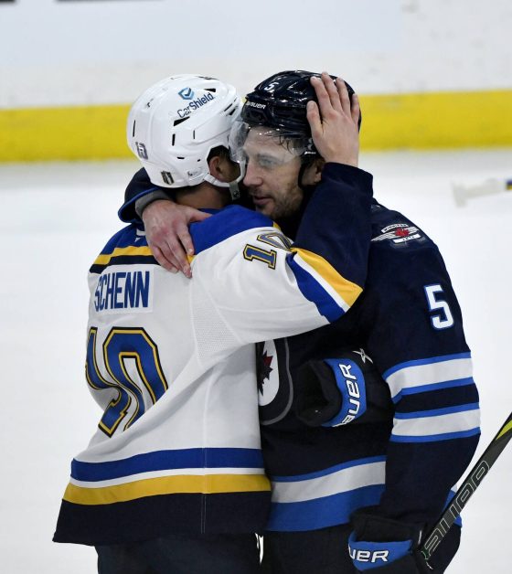 Winnipeg Jets’ Luke Schenn (right) embraces his younger brother Brayden Schenn after the Jets won their first-round series against the St. Louis Blues on May 7, 2025. (Fred Greenslade / The Canadian Press files)