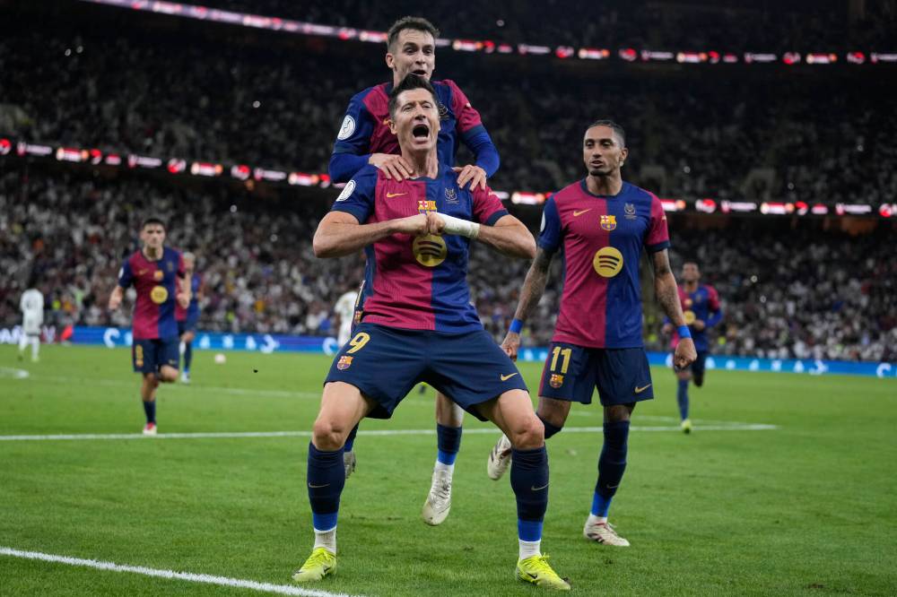 Altaf Qadri / The Associated Press files
                                Barcelona’s Robert Lewandowski (centre) celebrates after scoring during the Spain Super Cup final against Real Madrid in January.