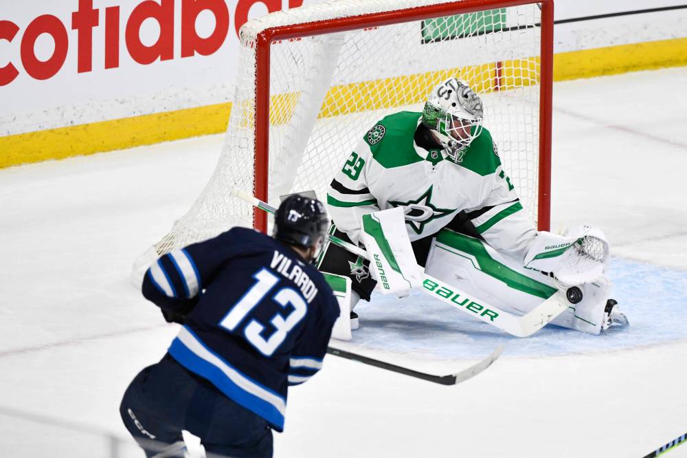 FRED GREENSLADE / THE CANADIAN PRESS
Dallas Stars goaltender Jake Oettinger (29) makes a save on Winnipeg Jets’ Gabriel Vilardi (13) during first period NHL playoff hockey action in Winnipeg, Wednesday, May 7, 2025.