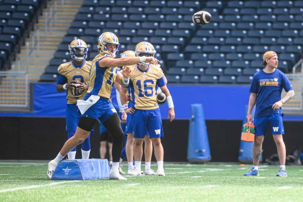 MIKE SUDOMA / FREE PRESS
Quarterback Chris Streveler throws the ball during training camp Sunday. Streveler suffered a season-ending injury last season, after tearing three of the four major ligaments in his left knee.