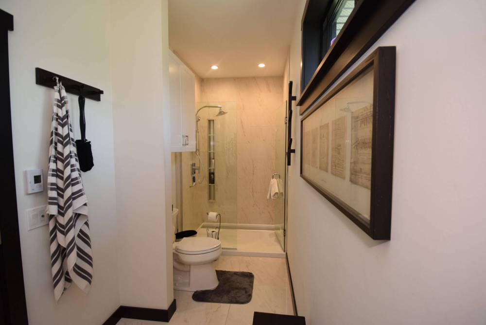 TODD LEWYS / FREE PRESS
The ensuite’s calling card is a luxurious, tiled walk-in shower.