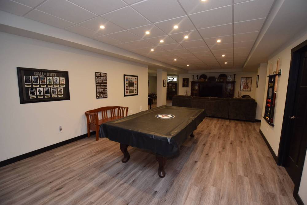 TODD LEWYS / FREE PRESS
Offering more than 2,000 sq. ft. of livable space, the lower level holds a rec room with games and media areas, a second games area, workout space and two more bedrooms.