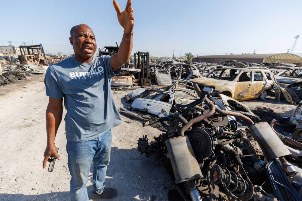MIKE DEAL / FREE PRESS
                                Godspower Emajemite rents a part of the lot that was burnt by fire.