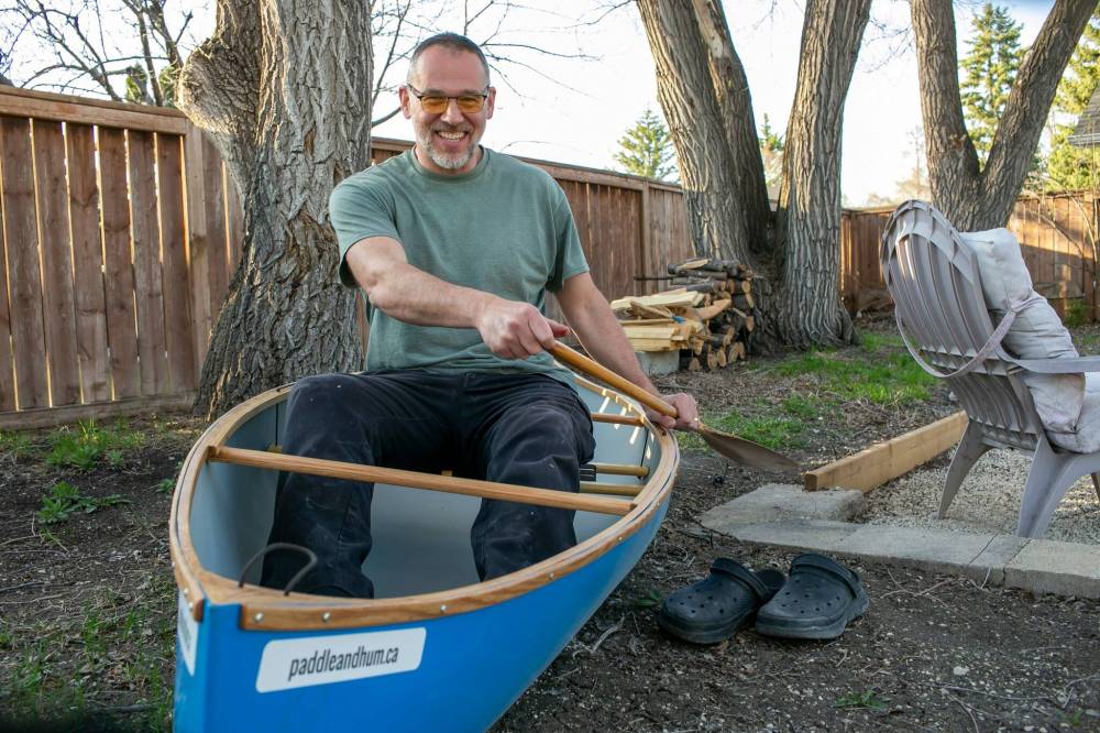 BROOK JONES/FREE PRESS Paddle and Hum owner Myron Sawatzky builds lightweight solo canoes in a backyard shed he converted into his workshop.