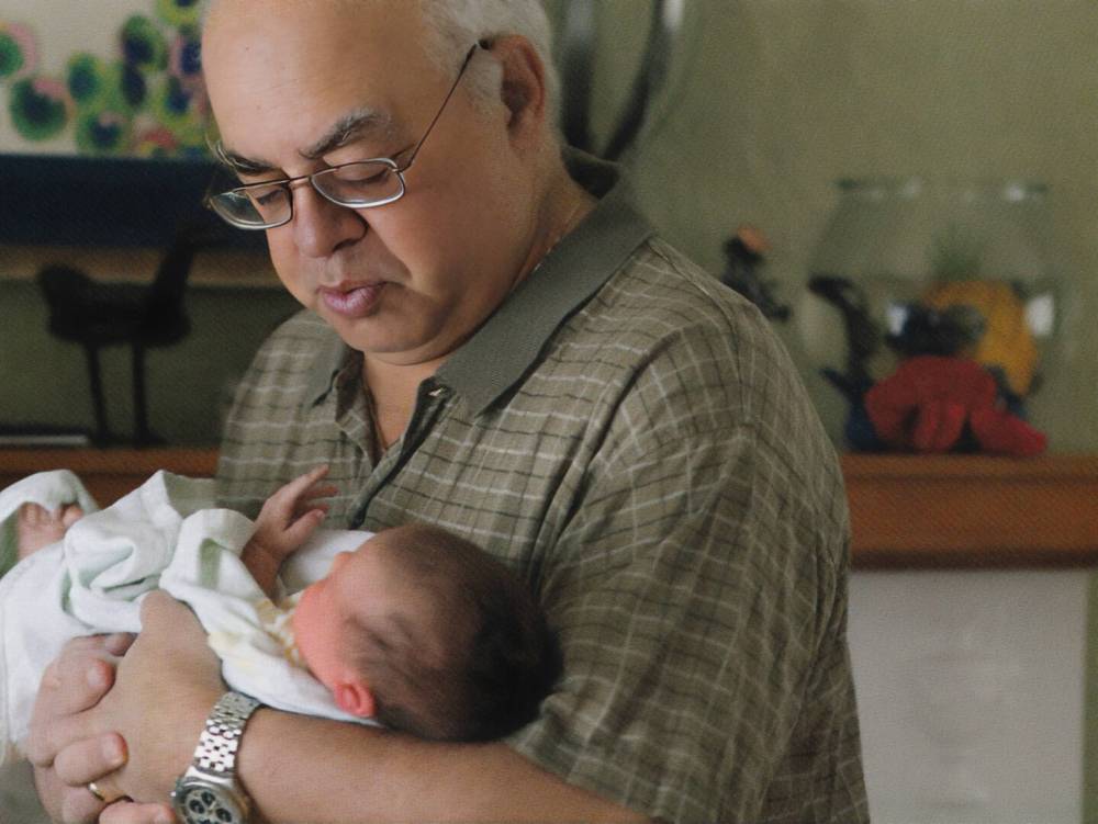 SUPPLIED
                                Norman Goldberg holding his infant grandson, Isaac, in 2010.