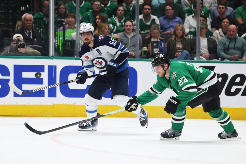 Gareth Patterson / The Associated Press
Winnipeg Jets centre Mark Scheifele shoots as Dallas Stars’ Esa Lindell defends during a Jets power play in the second period.