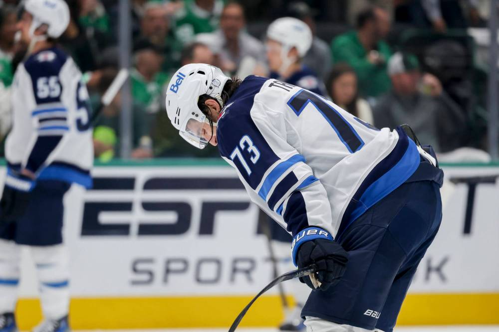 Gareth Patterson / The Associated Press
Jets froward Brandon Tanev leaves the ice at the end of the second period.