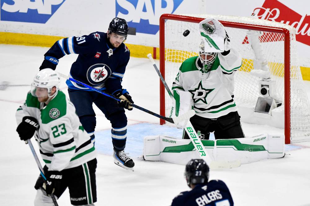 Fred Greenslade / CANADIAN PRESS
Dallas Stars goaltender Jake Oettinger makes a save on a shot by Nikolaj Ehlers as Cole Perfetti looks for the rebound in the second period.