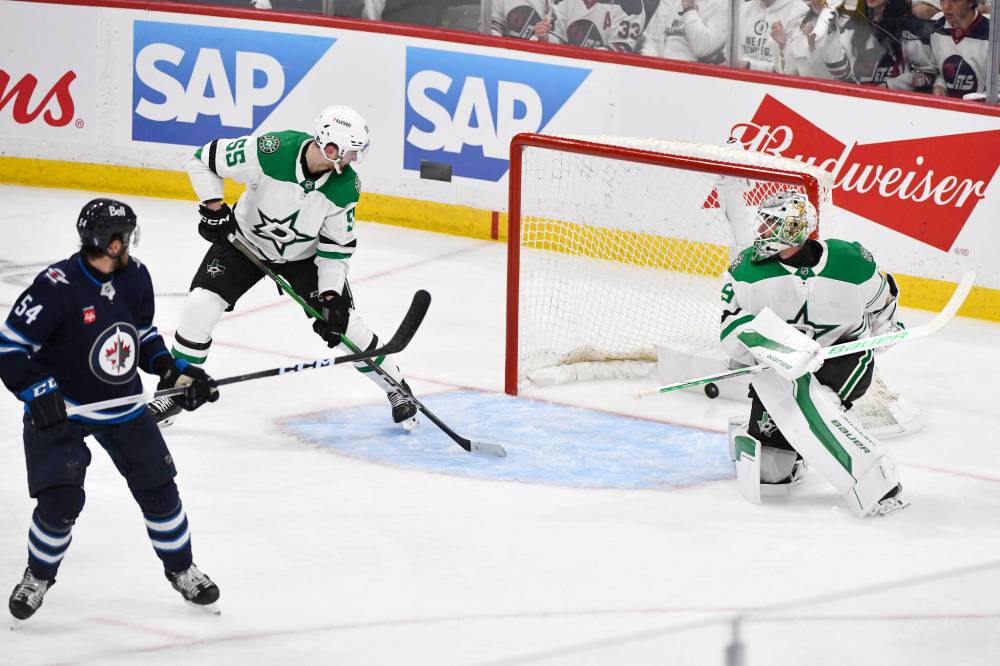 Fred Greenslade / CANADIAN PRESS
A shot by Winnipeg Jets’ Mark Scheifele goes off Dallas Stars’ Thomas Harley for the first goal of the game on goaltender Jake Oettinger during the second period.