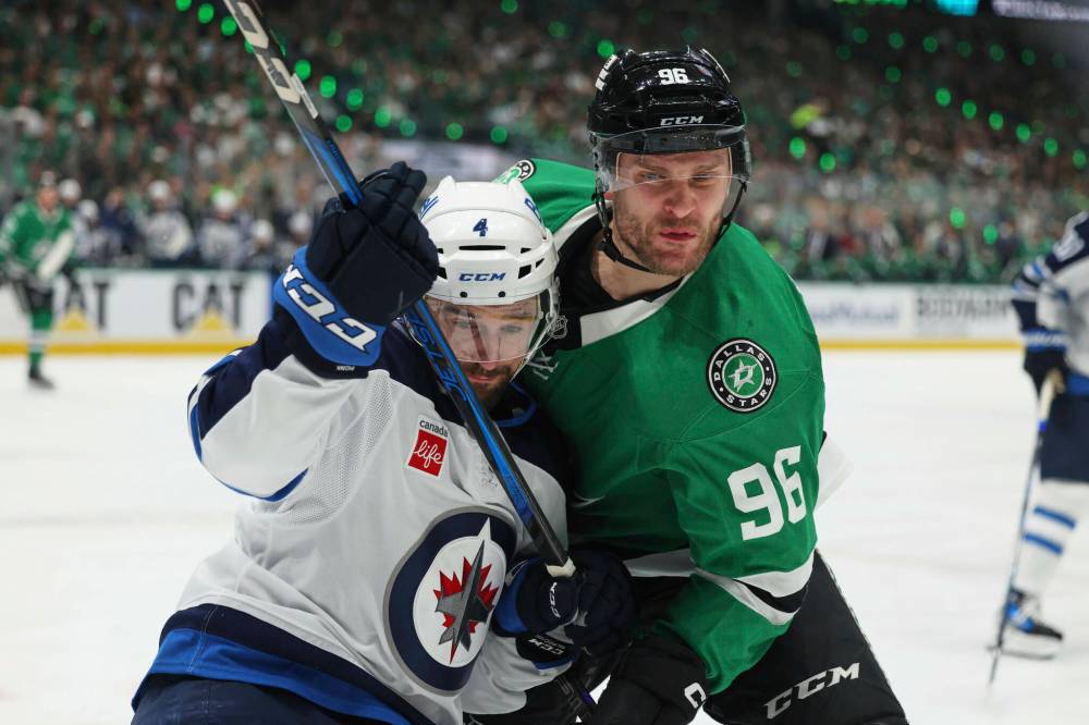 GARETH PATTERSON / ASSOCIATED PRESS
Winnipeg Jets defenseman Neal Pionk (4) and Dallas Stars right wing Mikko Rantanen (96) compete in the first period of Game 6 of a second-round NHL hockey playoff series in Dallas, Saturday, May 17, 2025.