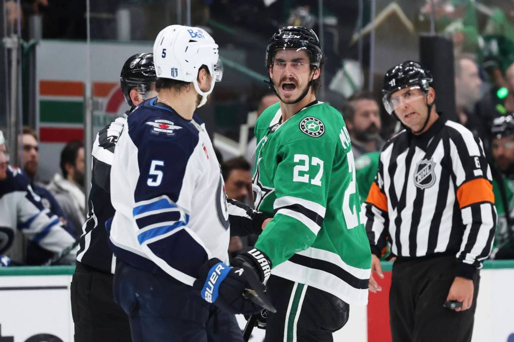 GARETH PATTERSON / ASSOCIATED PRESS
Dallas Stars’ Mason Marchment (27) and Winnipeg Jets’ Luke Schenn (5) exchange words as officials look on in the second period of Game 6 of a second-round NHL hockey playoff series in Dallas, Saturday, May 17, 2025.